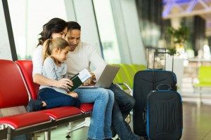 family using telehealth at airport